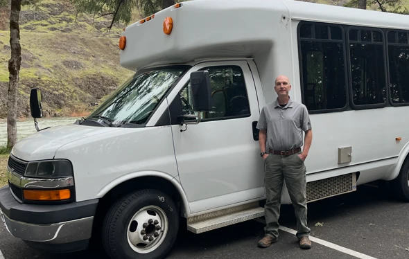 Chiropractor Sutherlin OR Nate Goodman In Front of Mobile Bus